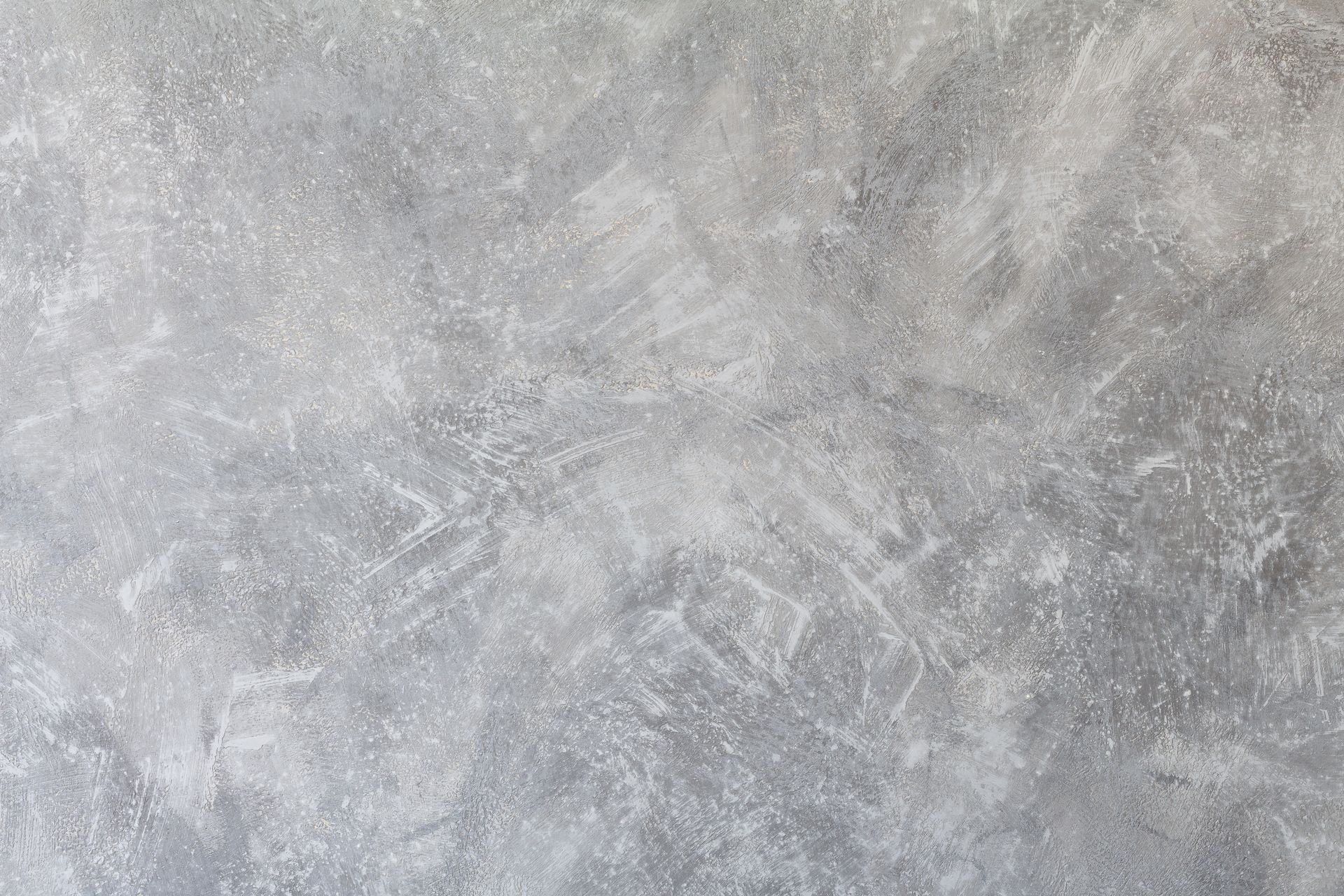 Textured concrete subfloor after professional flooring demolition and surface preparation.