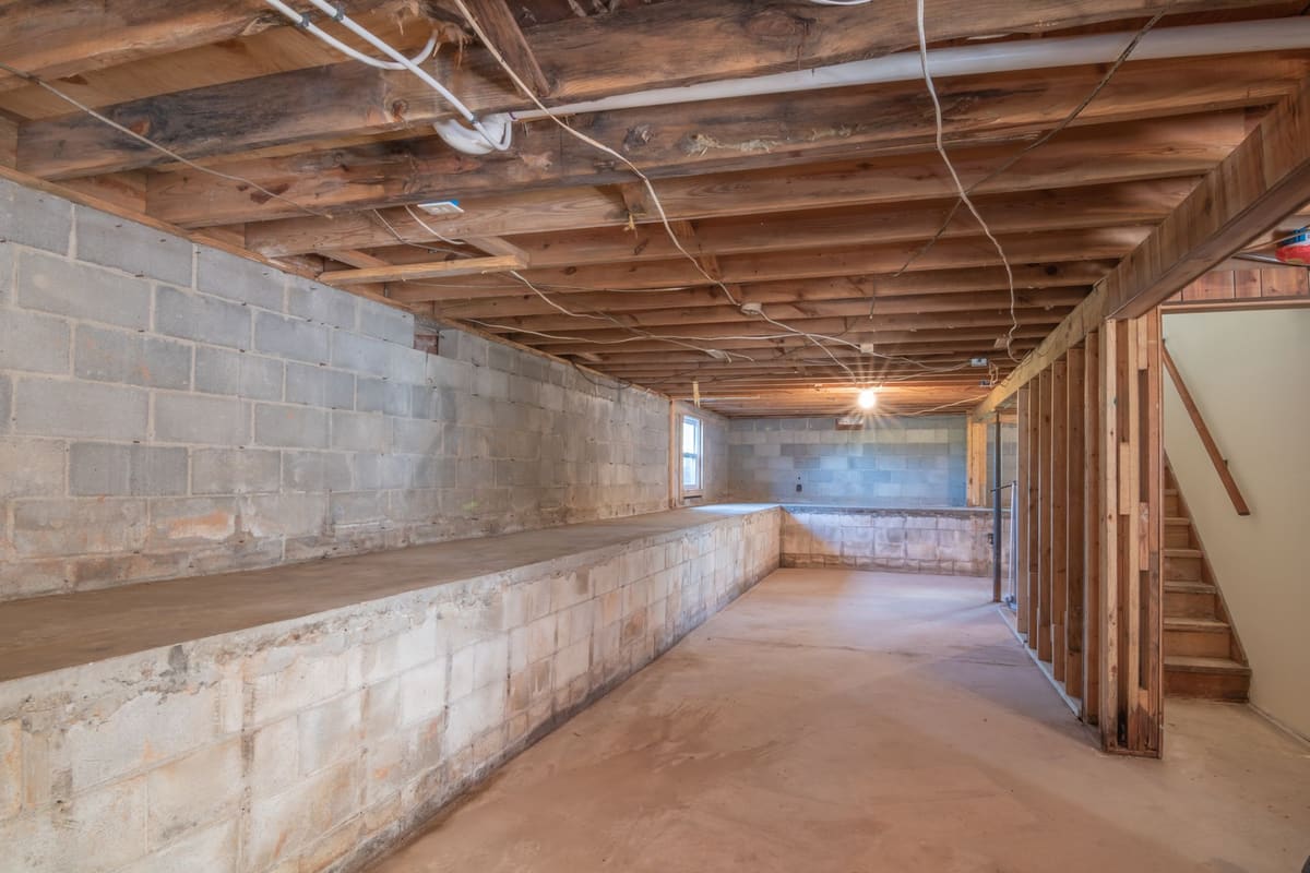 Bare subfloor exposed after old flooring has been stripped away