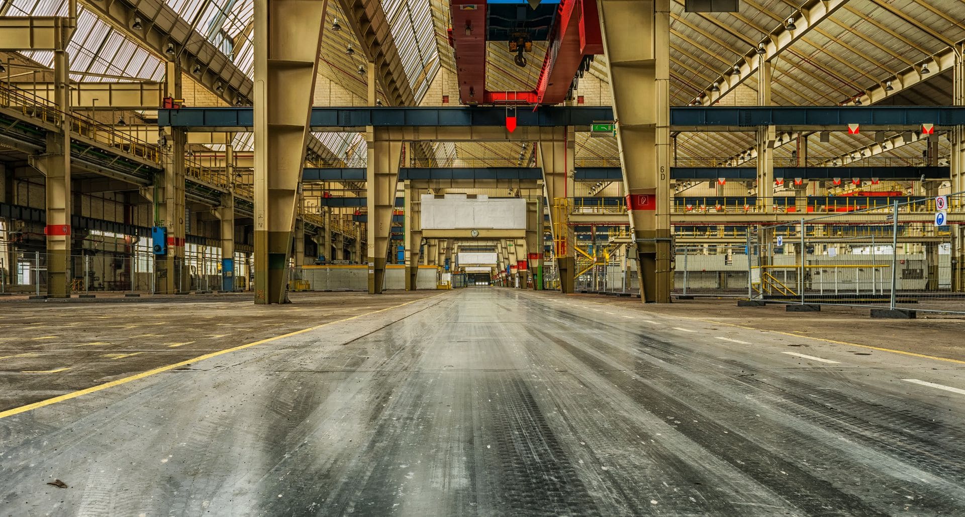Empty industrial warehouse with a clean prepared concrete floor