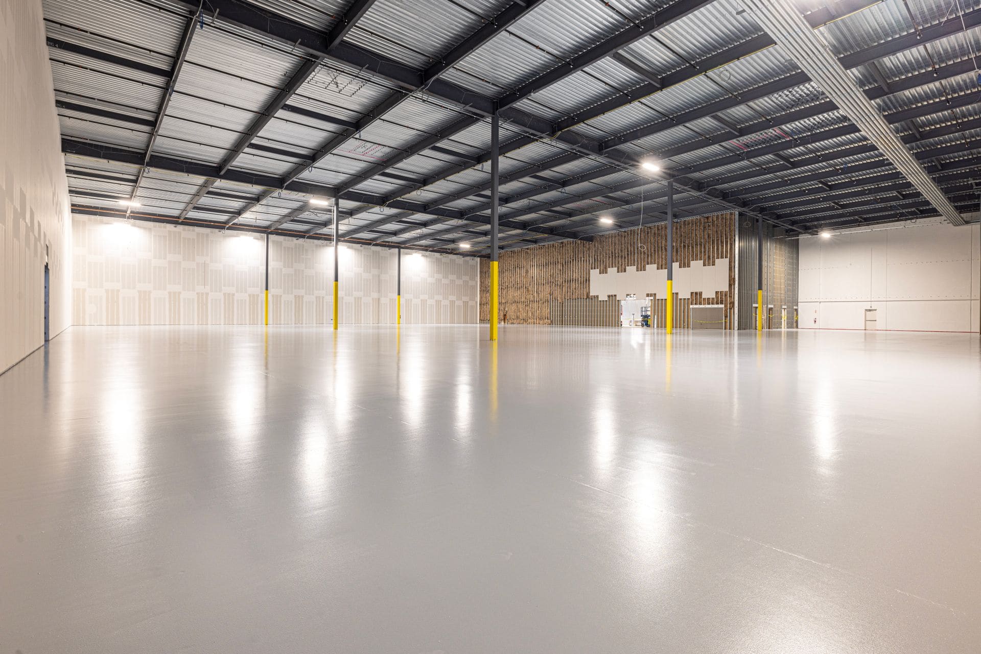 Bare concrete floor in a commercial unit stripped ready for new flooring