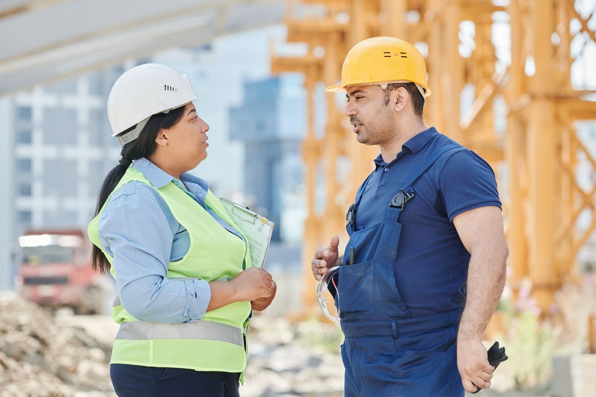 Contractor going over a demolition project plan on site