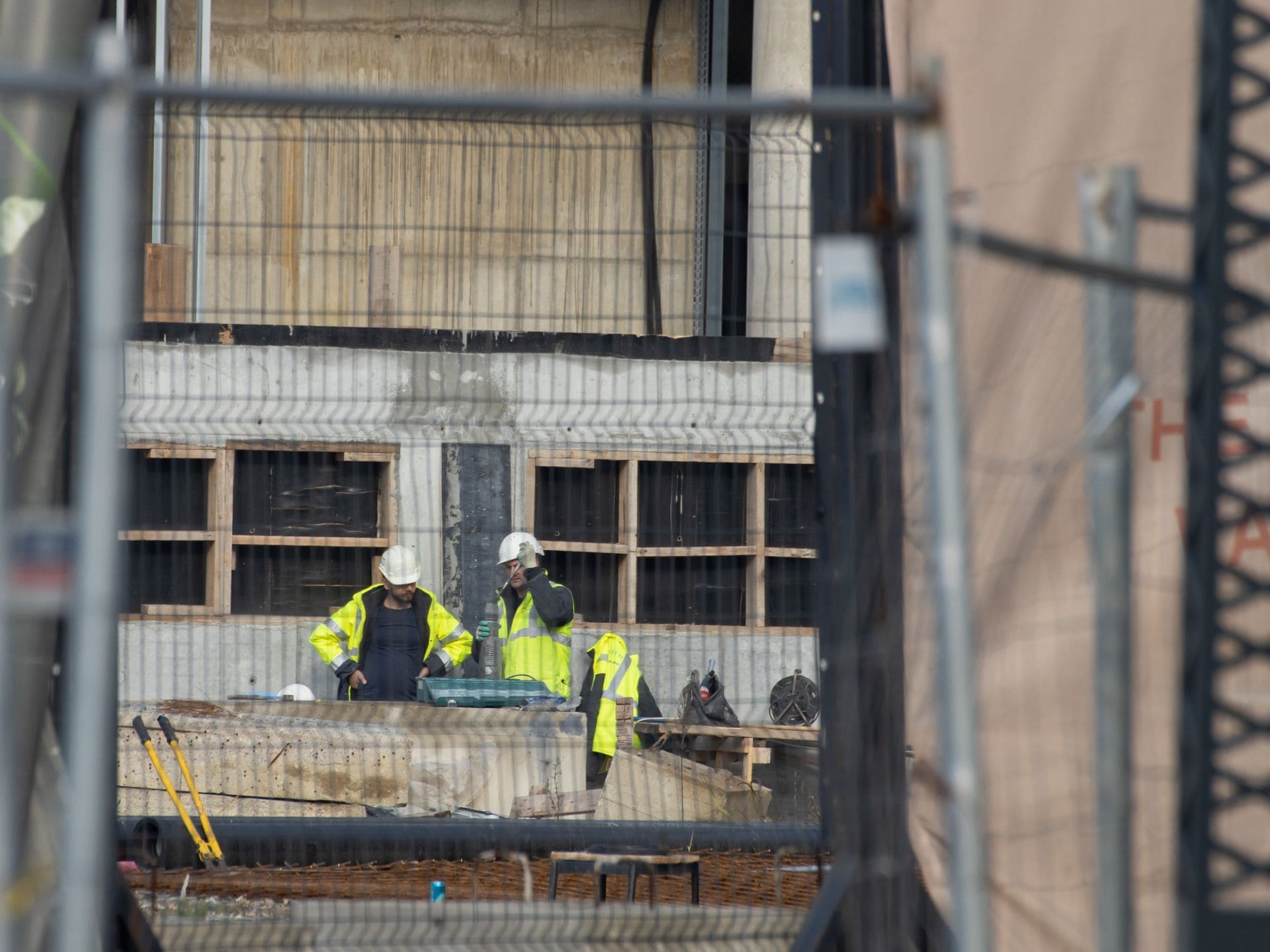 Demolition crew in hard hats working on a commercial jobsite