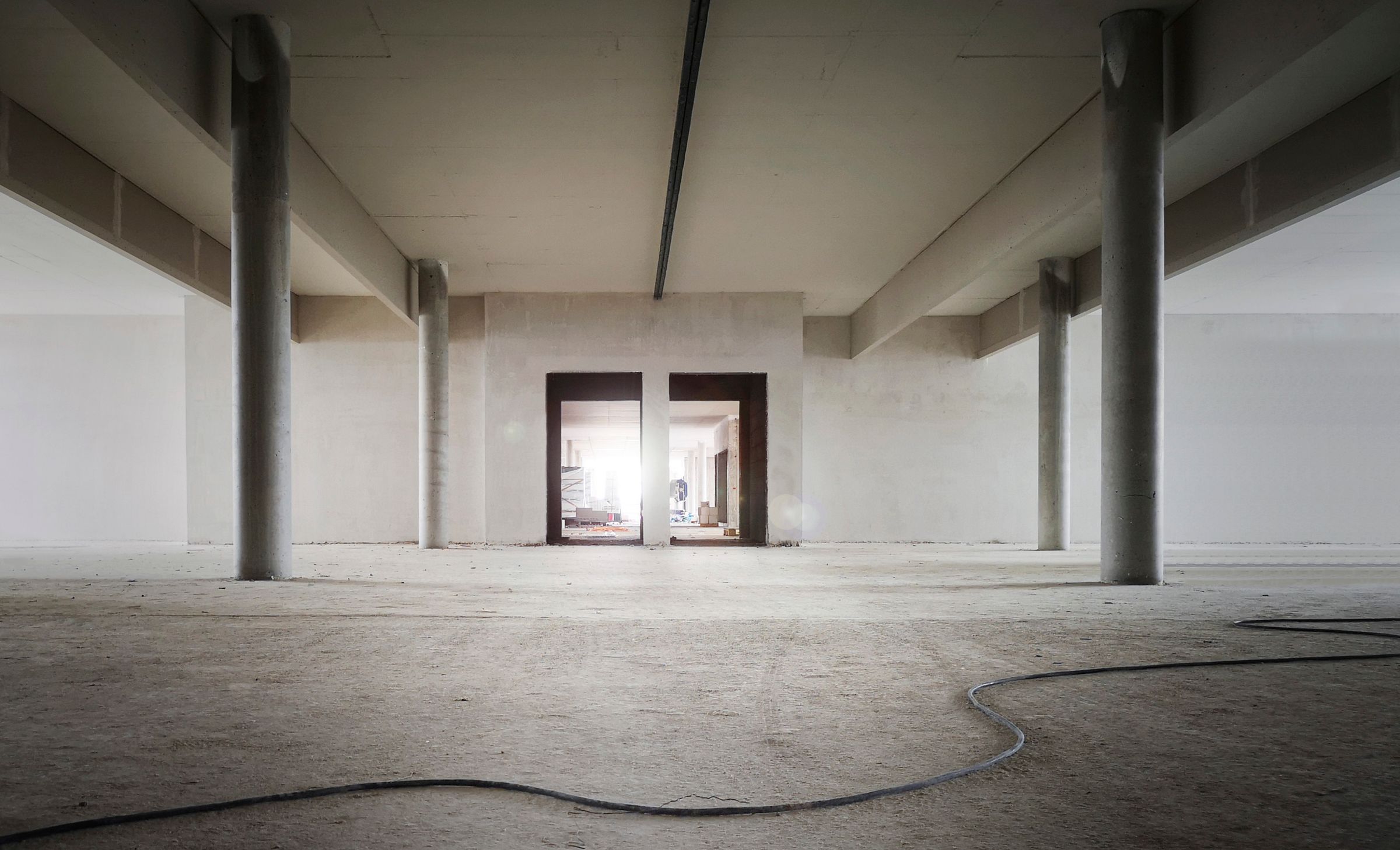 Commercial interior stripped back to concrete columns and unfinished walls during interior demolition