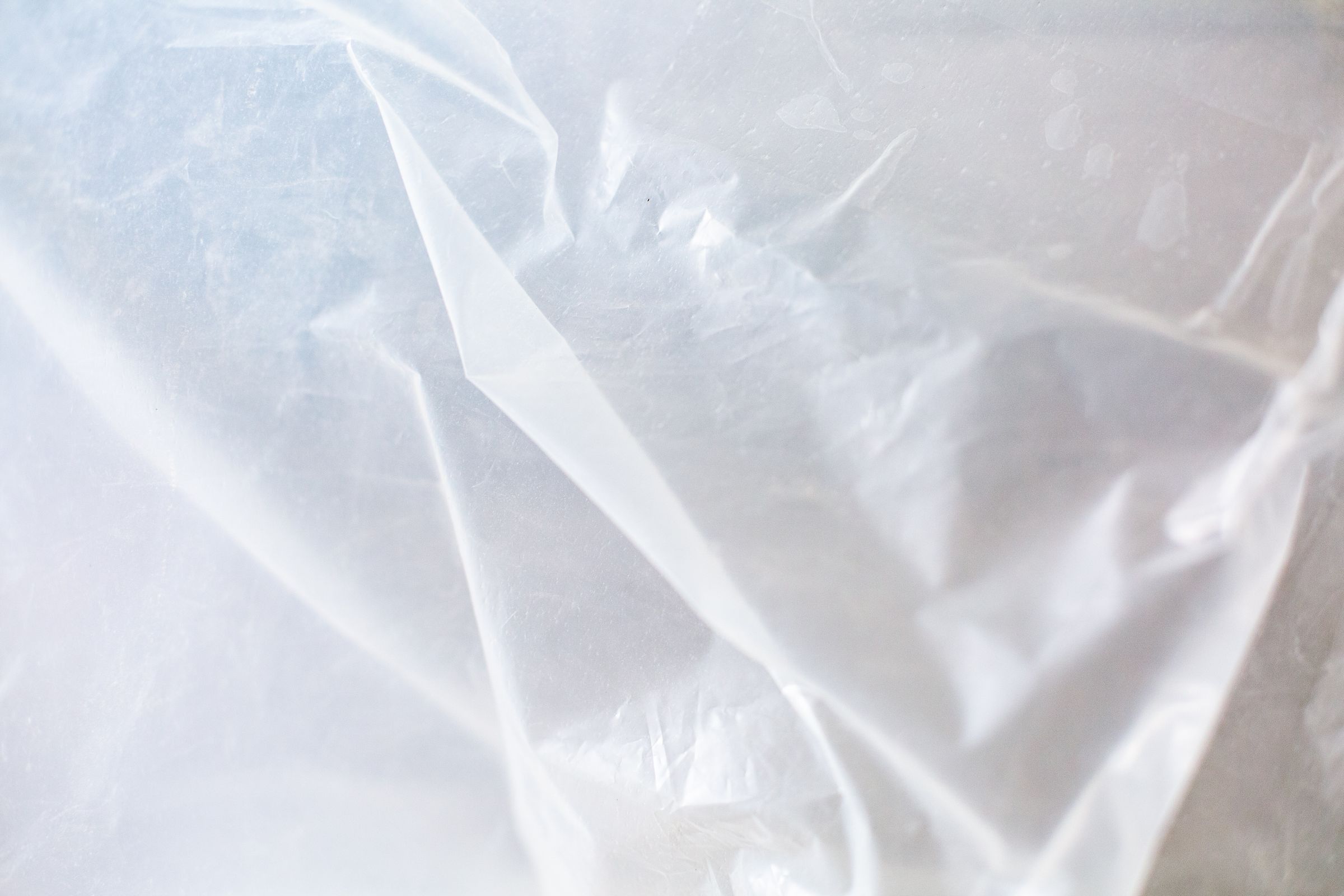 Clear plastic sheeting used to cover and seal off surfaces during renovation work
